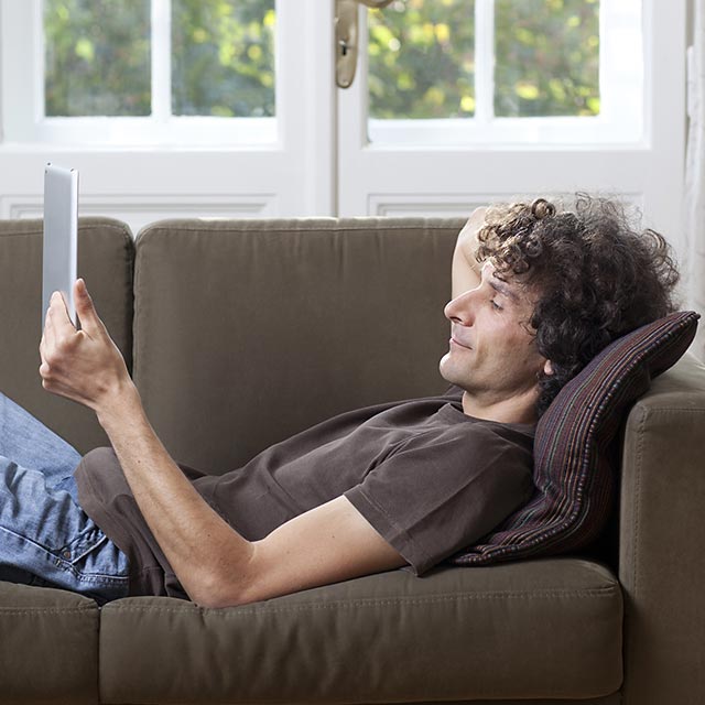 reading-tablet-on-couch177097351.jpg